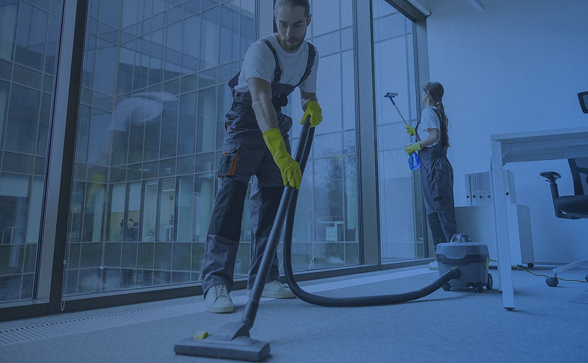A stylized photo of a crew performing cleaning activities on an industrial setting